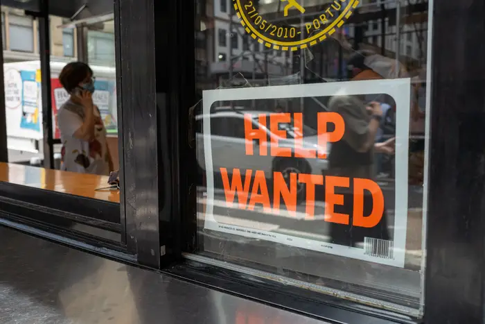 A stock photo of a Help Wanted sign